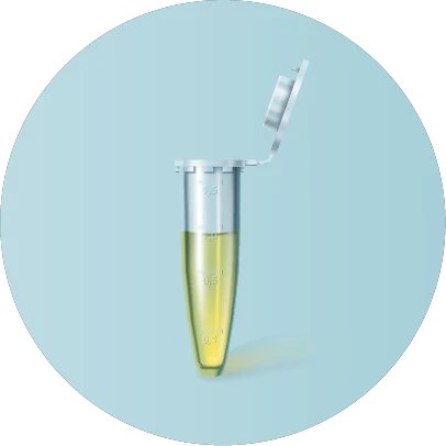 Test tube filled with a yellow liquid in front of a blue background